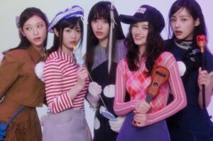 NewJeans pose for a photo.