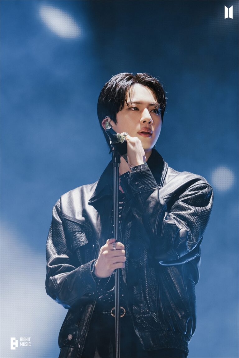 BTS Jin performs on a stage.