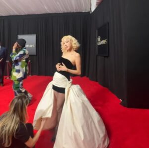 Rose prepares for attending the Grammy Awards.