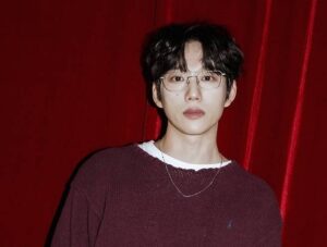 10cm poses for a photo.