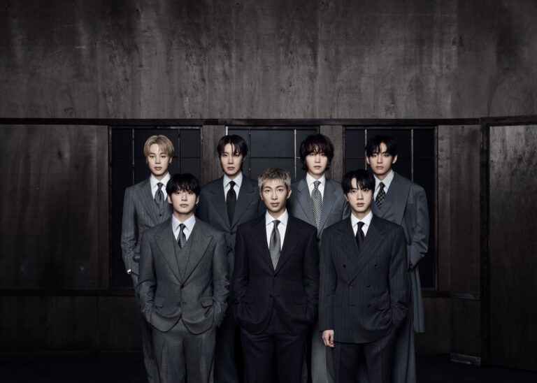 BTS ARIRANG comeback group portrait in formal suits, highlighting unity and professionalism.