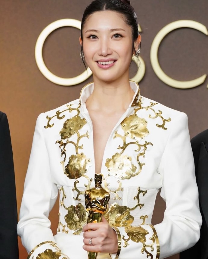 EJAE Oscars outfit with gold embroidery and cultural design