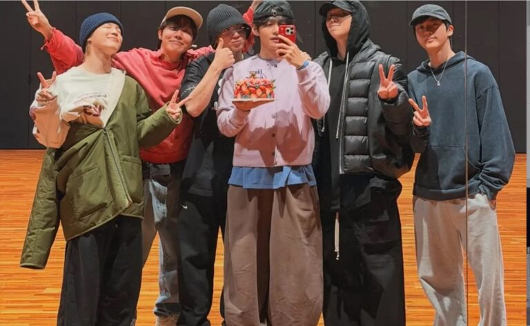 BTS members pose for a photo.