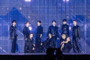 SEVENTEEN members perform on a stage.  