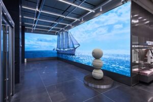 A large media wall and art installation set up at HYBE Yongsan HQ pop up store on the first floor (Photo / HYBE)