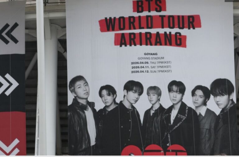 Promotional poster for BTS World Tour “ARIRANG,” featuring the seven members in dark outfits with tour dates listed for Goyang Stadium in April 2026.