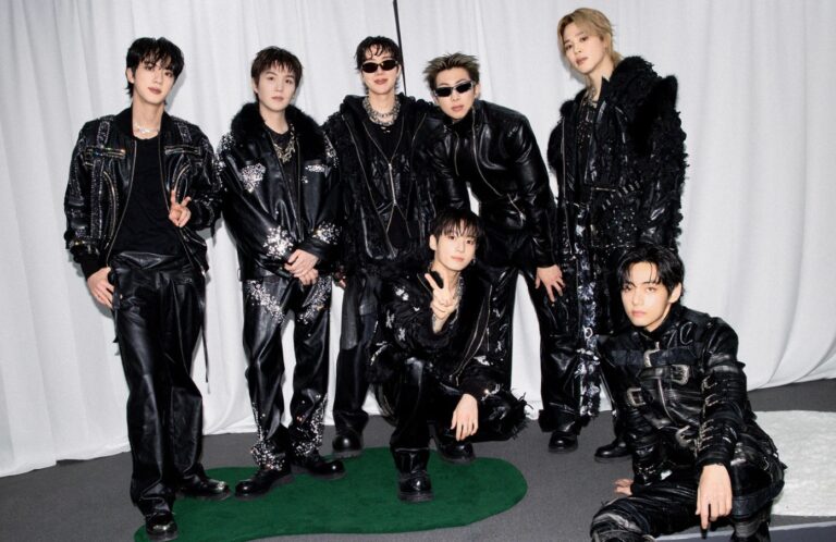 BTS members pose for a photo.