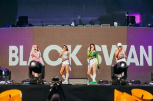 Multinational girl group Black Swan performs on a stage.