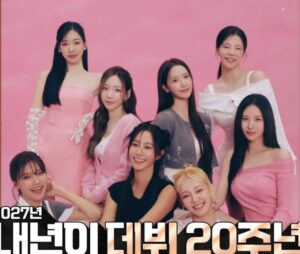 Girls’ Generation members in a pink-themed group photo ahead of 20th anniversary