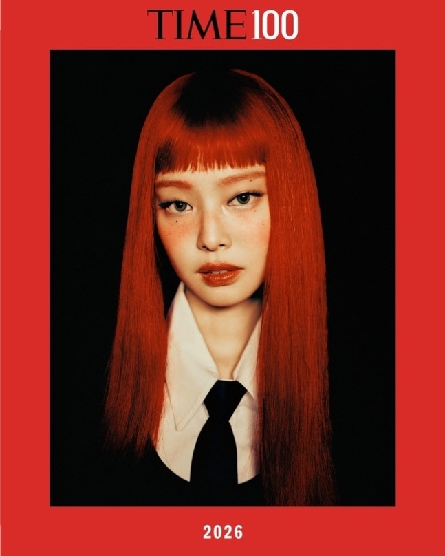 Magazine cover featuring BLACKPINK’s Jennie with vivid red hair, highlighted on TIME100’s 2026 list.