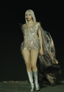BLACKPINK’s Lisa performs in a futuristic silver bodysuit with cape during Coachella set.