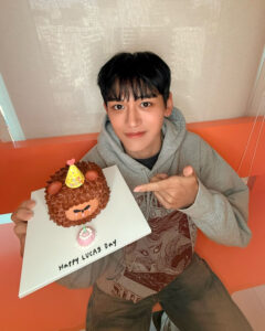 Lucas shows a birthday cake in the photo.