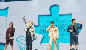 SHInee ,members perform on a stage.