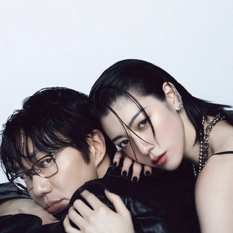 Sung Si Kyung and Ayaka Miyoshi pose together in a sleek editorial portrait, styled in modern fashion.
