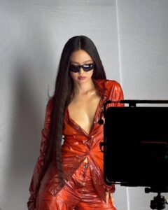 Fashion photo of BLACKPINK’s Jennie in translucent clothing with structured shoulders, highlighting delicate textures.