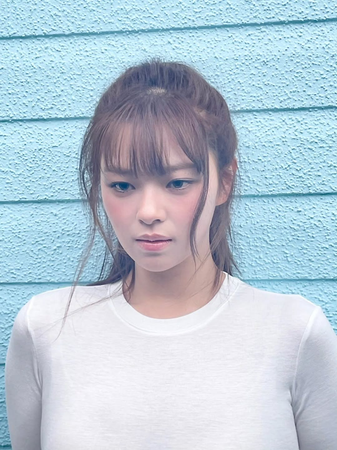 Jeongyeon poses in natural and urban settings, wearing casual outfits with soft makeup and long brown hair, highlighting her slimmer visuals and confident charm.