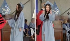 Annie poses for a camera during her college graduation ceremony.  (Photo / YouTube Screenshot)
