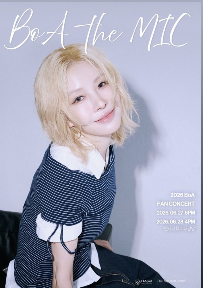 BoA poses with a soft smile in a striped navy top and white shirt on the promotional poster for her 2026 fan concert BoA the MIC.