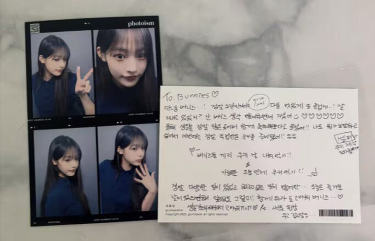 Minji 's letter to fans during her visit to her birthday party cafe .