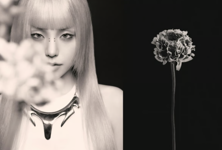 Close-up of Yeji in artistic black-and-white portrait with floral detail.