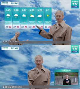 SHINee’s Key presents a mock weather forecast on “ATMOS TV LIVE,” wearing a beige trench coat against a blue sky backdrop, pointing to dates tied to the group’s comeback schedule.