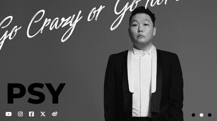 Black‑and‑white promotional photo of PSY in formal attire with the phrase “Go Crazy or Go Home” written above.