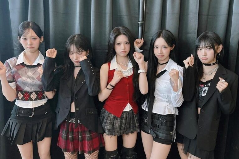 Rescene members pose for a camera.