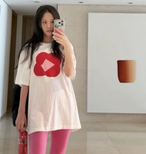 BLACKPINK Jisoo poses for a mirror selfie inside her art-filled home.