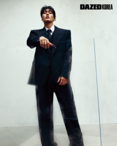 ATEEZ San wearing a black suit in his Dazed Korea pictorial.