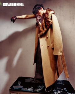 ATEEZ San wearing a long beige coat in Dazed Korea